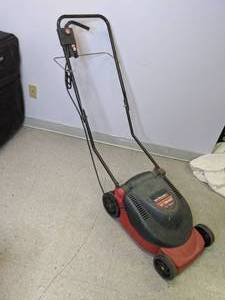 lot 674 image: Yard Machines 13  1000 Watt Electric Lawn Mower