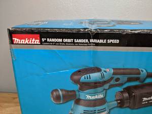 lot 9 image: Brand New Makita 3 Amp 5 in. Corded Variable Speed Random Orbital Sander with Dust Bag
