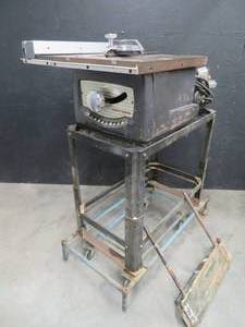 VINTAGE CRAFTSMAN TABLE SAW ON METAL ROLLING TABLE.