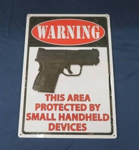 NEW IN PLASTIC METAL WARNING SIGN.