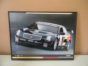 CADILLAC RACING BREAK THROUGH PROFESSIONALLY FRAMED PRINT - NICE PIECE - APPROX 24 BY 19 - SEE PICTURES