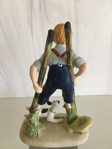 lot 35 image: Norman Rockwell Figurine The Danbury Mint- Boy on Stilts