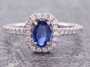 lot 36 image: Natural Blue Sapphire and Diamond Halo Ring in 14k Gold $2,850 Retail