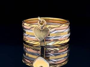 lot 69 image: Tri-Color Stacker Band Ring with Dangle Heart in 14k Gold $1000 Retail