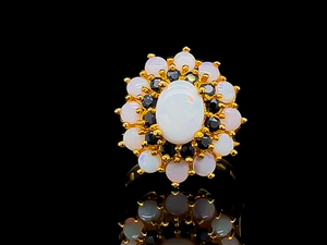 lot 97 image: Center Opal Ring With Double Halo of Midnight Blue Sapphires and Opals
