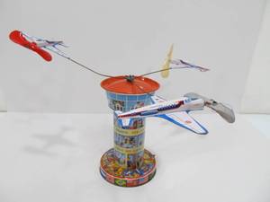 lot 31 image: Vintage Western Germany Tin Litho Spinning Airplane Airport Toy