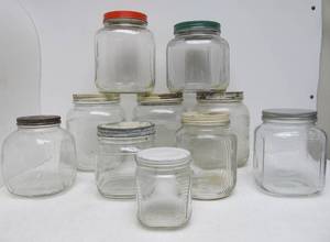 lot 160 image: Lot of 10 Vintage 1940s Era Embossed Glass Kitchen JarsCanisters