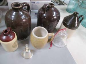 lot 479 image: Clay Water Jugs, mug and some bells...