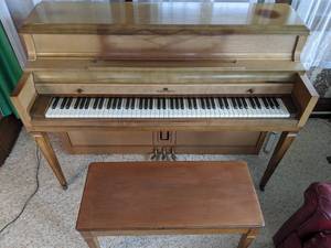 Wurlitzer Upright Piano with Bench and Sheet Music