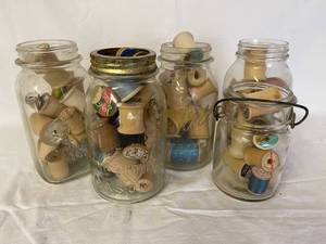 lot 141 image: Vintage Wooden Thread Spools In Mason Jars