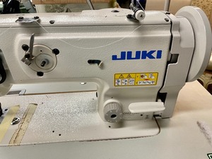 lot 200 image: Juki Industrial Sewing Machine with a Family Electric Servd Motor