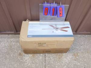 52 Brookhurst ceiling fan. New in box. Box appears to have been damaged in shipment. As shown.