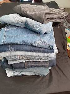 14 Pair of Mens Jeans Average Size...
