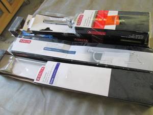 lot 171 image: 4 Assorted Delta Towel Bars...