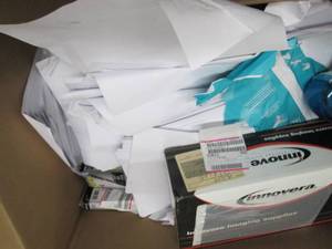 box of printer paper , pens , speed...