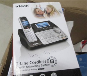 box of printer paper , phones ,tone...