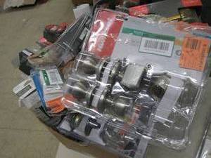box of door locks and knobs some ma...