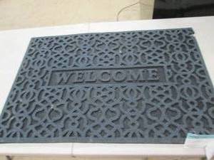 24x36 welcome mat has a small rip o...