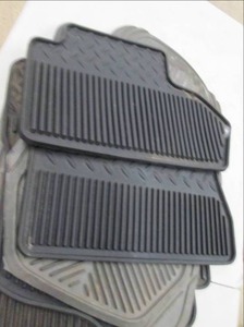 lot of used rubber car mats ...
