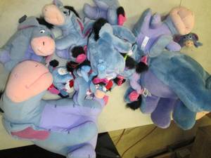 lot of stuffed eeyore animals ...