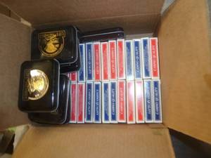 37 decks of cards and 8 tin boxes to store decks in