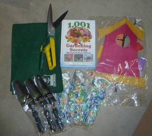gardening lot - 3 pair of gloves, clipper, 3 shovels, gardening book, windmill whirlygig and an indoor transplanting mat