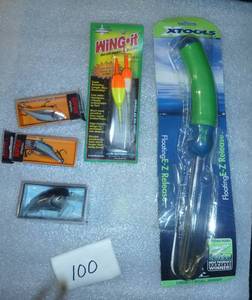 3 new fishing lures, a hook remover, and bobbers