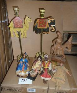 Lot of unique international items, 2 tall metal candle holders, wood carved man on a donkey, and 4 dolls.