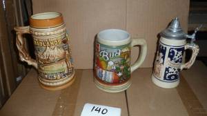 3 Steins in great condition, South Dakota Badlands and Mount Rushmore, Budweiser St Patricks Day and a German lidded stein