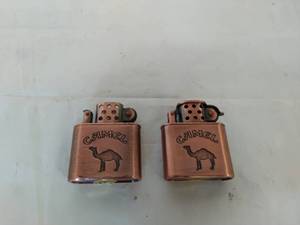 lot 68 image: Two Camel Lighters