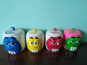 lot 98 image: Set of Four M&Ms Canisters