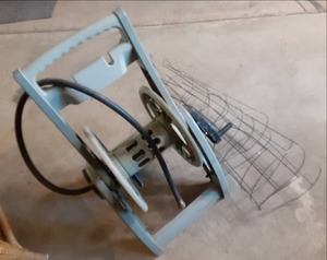 lot 48 image: Hose Reel and Tomato Plant Stands...
