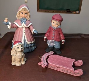 lot 233 image: Winter Decor Boy, Girl & Dog Figurines and Sled Door Hanging