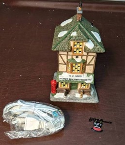 lot 215 image: Dept. 56 Dickens Village Lighted Building A.G. Scotts Hats & Walking Sticks