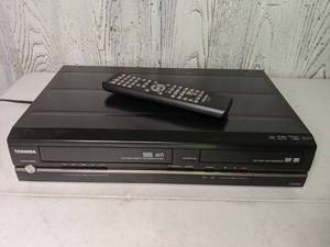 lot 401 image: Toshiba VHSDVD Player with Remote