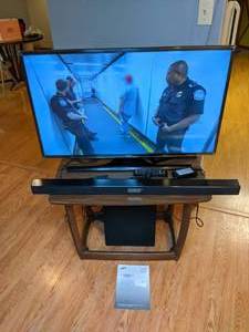 lot 52 image: Samsung 40 UHD TV, Blu Ray Player, Soundbar and Subwoofer