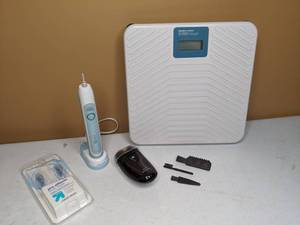 lot 466 image: Norelco Electric Razor, SoniCare Toothbrush, Digital Scale