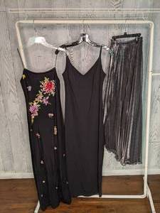 lot 470 image: (2) Slinky Black Dresses and Long Metallic Skirt