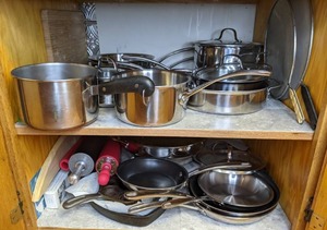lot 344 image: Contents of Cupboard Cast Iron, Stainless Steel & Nonstick Pots and Pans