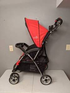 lot 703 image: Kolcraft Cloud Plus Lightweight Easy Fold Compact Travel Baby Stroller