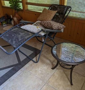 lot 555 image: Zero Gravity Patio Chair, Throw Pillows, End Table