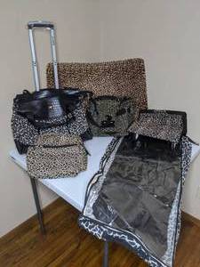 lot 677 image: Leopard Print Luggage, Garment Bag and Bath Mat