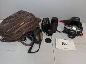 lot 812 image: Vintage Nikon FG 35mm Film Camera with Extra Lenses and Carrying Case