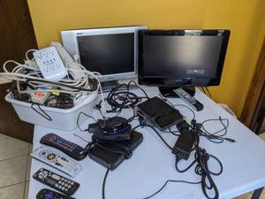 lot 694 image: 18 Toshiba TV, 15 Magnavox TV, Power Strips, Roku Box, etc.