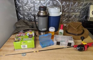 lot 797 image: Fishing and Outdoor Gear Rod, Lures, Thermos, Hats, etc.