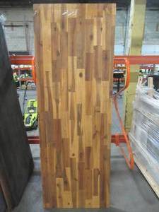 lot 607 image: Interbuild Acacia 6 ft. L x 25 in. D x 1 in. T Butcher Block Countertop in Golden Teak Stain, 122155 - Small Crack and EdgeCorner Damage.