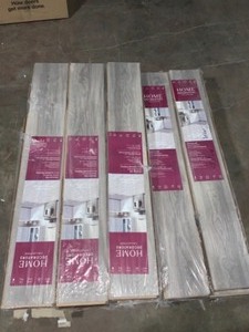 lot 20 image: HOME DECORATORS COLLECTION WATER RESISTANT EIR SILVERTON OAK 8 MM THICK X 7-12 IN. WIDE X 50-23 IN. LAMINATE FLOORING (23.69 SQ. FT.CASE). SEE PICTURES