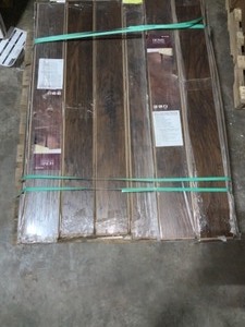 lot 22 image: HOME DECORATORS COLLECTION HAND-SCRAPED TANNED HICKORY 12 MM THICK X 5-932 IN. WIDE X 47-1732 IN. LENGTH LAMINATE FLOORING (12.19 SQ. FT.  CASE). SEE PICTURES