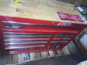 lot 63 image: HUSKY 42 in. W x 18.1 in. D 10-Drawer Mobile Workbench with Solid Wood Top in Red