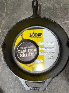 lot 6 image: LODGE 12 IN. CAST IRON SKILLET IN BLACK WITH POUR SPOUT. SEE PICTURES